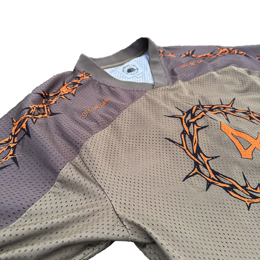 Close-up of the premium v-neck collar and ribbed fabric details on the Off The Grid jersey.