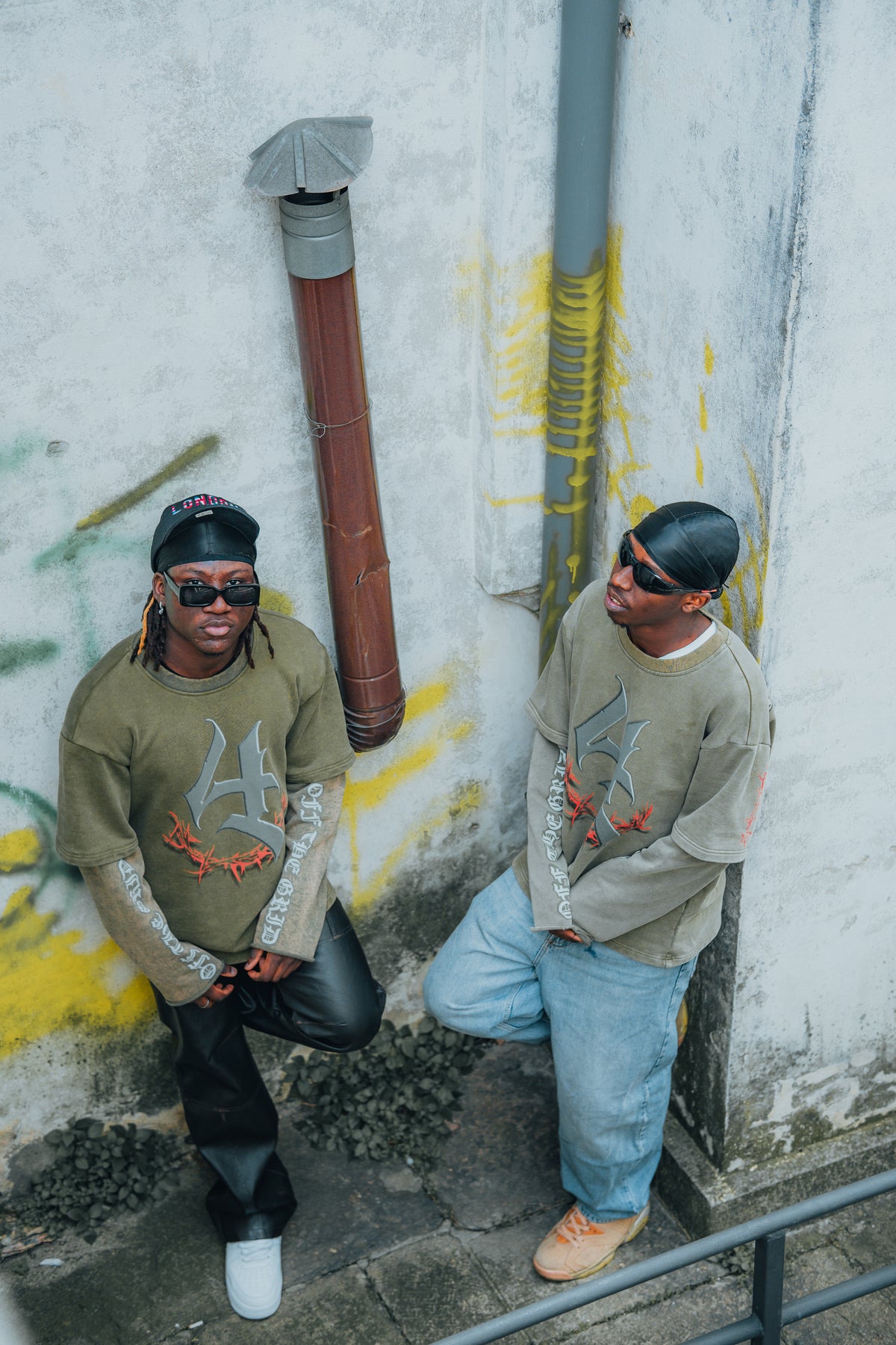 Model styling the Off The Grid acid green graphic longsleeve shirt for an urban streetwear look.