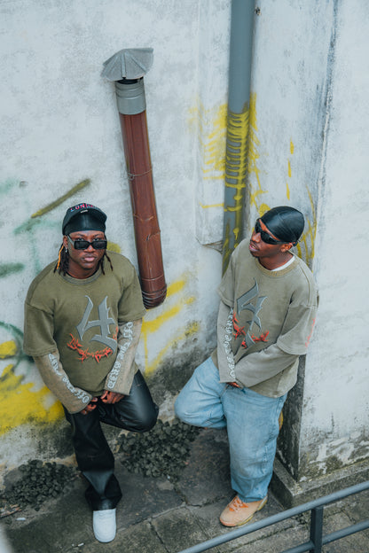 Model styling the Off The Grid acid green graphic longsleeve shirt for an urban streetwear look.