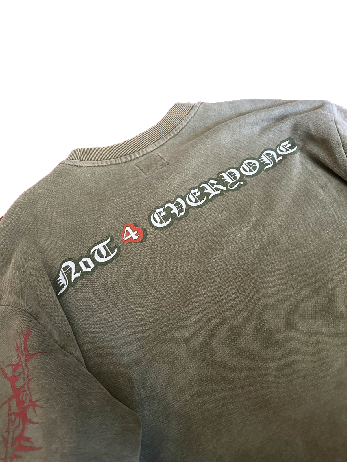 Detail of the premium 100% cotton French Terry texture and sewn logo label on the Off The Grid longsleeve.