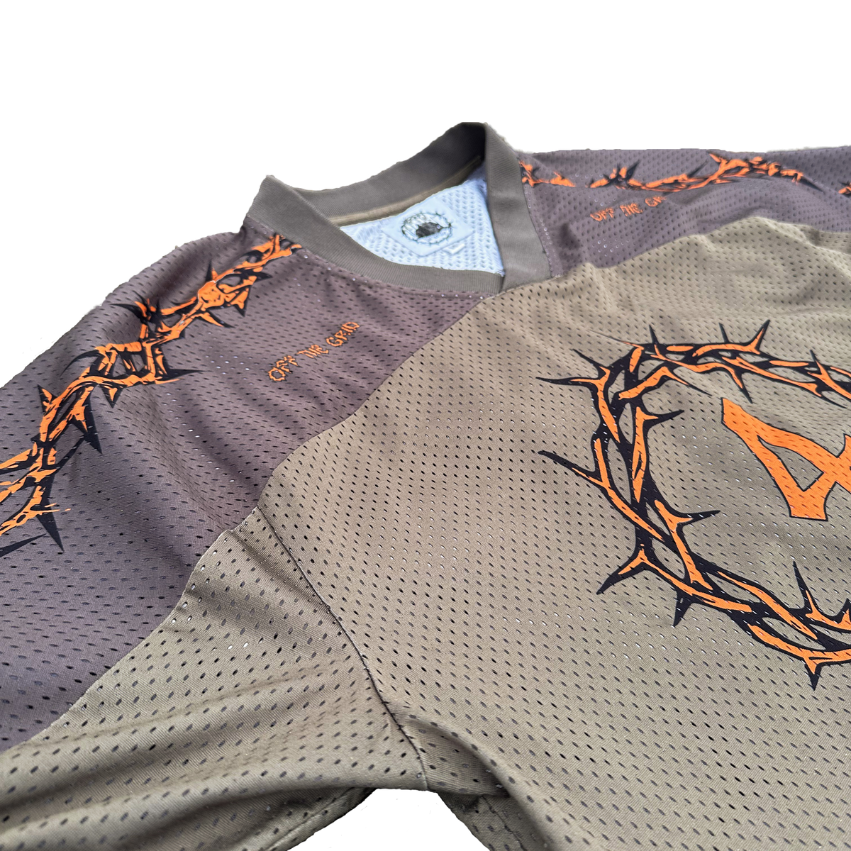 Close-up of the premium v-neck collar and ribbed fabric details on the Off The Grid jersey.